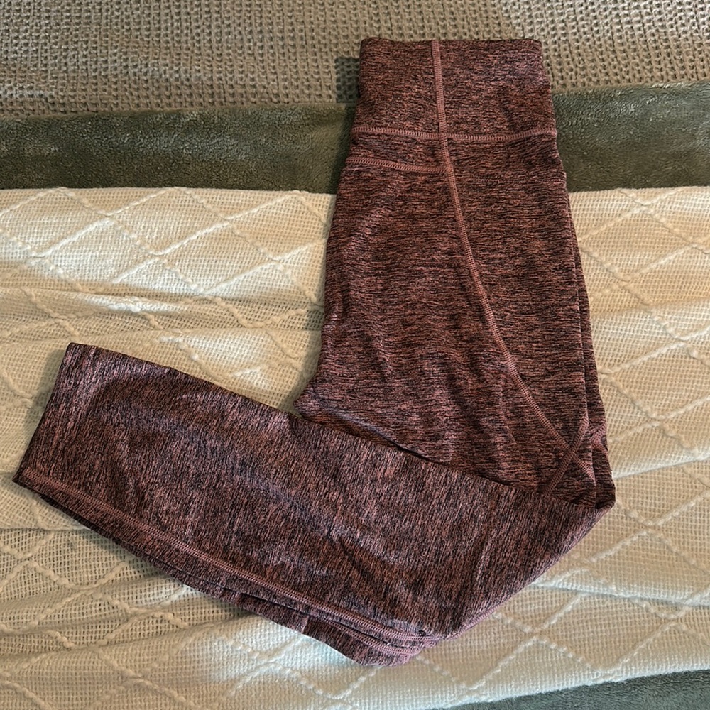 Black and purple active wear leggings with built in side pockets for phone